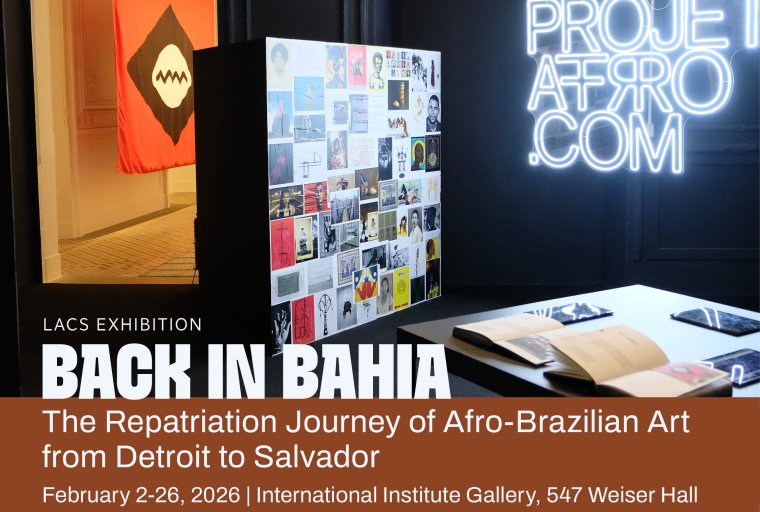A promotional banner for the LACS exhibition titled "BACK IN BAHIA: The Repatriation Journey of Afro-Brazilian Art from Detroit to Salvador." The background shows an indoor gallery space featuring a neon sign for "PROJETOAFRO.COM," a collage of small artworks on a black pillar, and open books on a display table. In the background, a red flag with a black and white circular emblem is visible. The exhibition runs from February 2–26, 2026, at the International Institute Gallery, 547 Weiser Hall. Presented by the Center for Latin American and Caribbean Studies and the Institute for the Humanities.