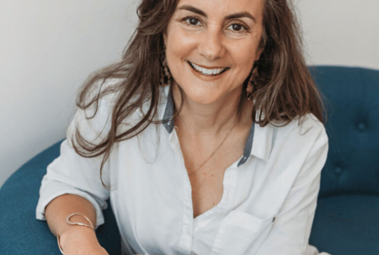 Headshot of Hallie Crawford, career coach and speaker, with long brown hair, wearing a white top, smiling at the camera. She will present the alumni career webinar ‘5 Ways to Fix Your Resume for Today’s Job Market’ on Tuesday, May 19 at noon Eastern Time.