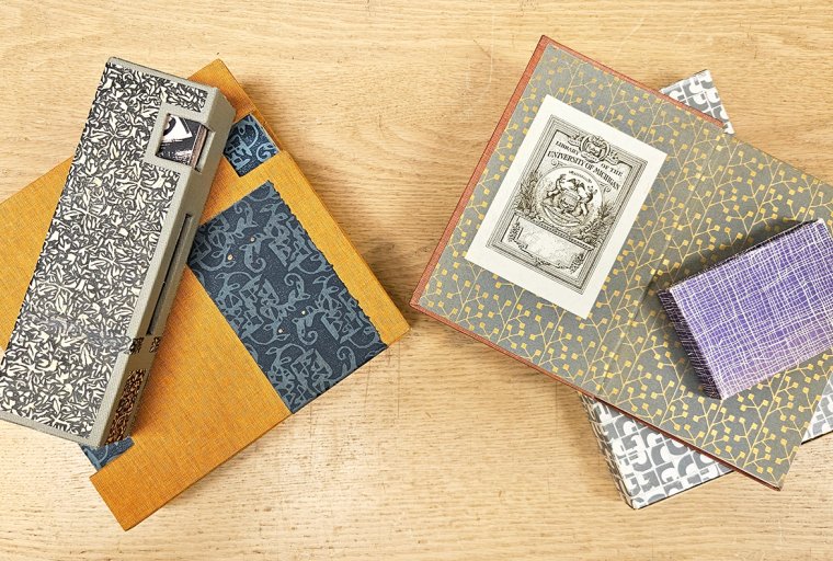 Several books adorned with decorative paper.