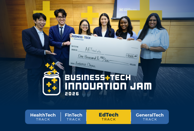 A winning team holding a check at the competition finale