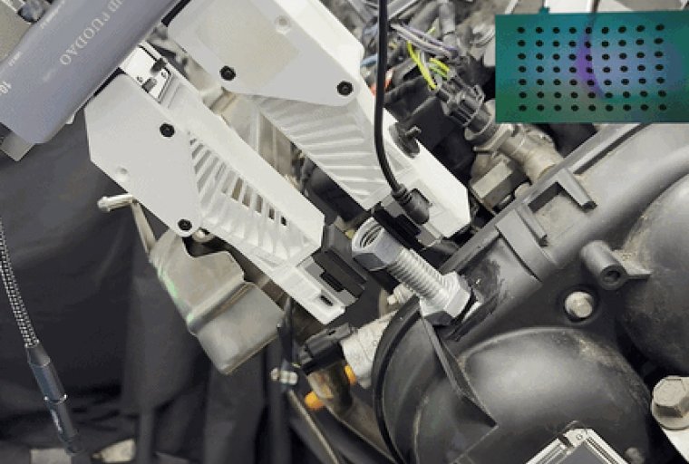 Robotic end effector places hex nut onto bolt.