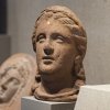 Clay head of a woman on display in the Kelsey Museum’s Roman collection.