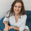 Headshot of Hallie Crawford, career coach and speaker, with long brown hair, wearing a white top, smiling at the camera. She will present the alumni career webinar ‘5 Ways to Fix Your Resume for Today’s Job Market’ on Tuesday, May 19 at noon Eastern Time.