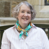 Professional headshot of Dr. Laura Lamps smiling in business attire, conveying a warm, knowledgeable, and approachable presence.