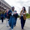A student docent leads a walking tour.