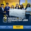 A winning team holding a check at the competition finale