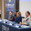 Panel of four female speakers in front of M CLOSUP banner.