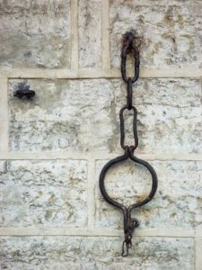 Shackles represent America's past experience with slavery