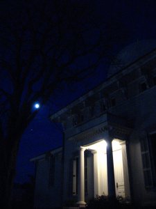 The Detroit Observatory at night with the Moon and Jupiter
