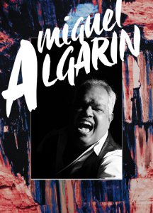 B&W photo of Miguel Algarin over painted rocks. B&W photo of Miguel Algarin over painted rocks.
