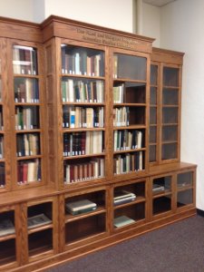 Custom bookcase in the Hatcher Library Gallery, housing the Azad and Margaret Ho