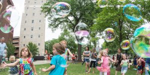 Children playing with giant bubbles at Ann Arbor Summer Festival. Credit: A2 Sum