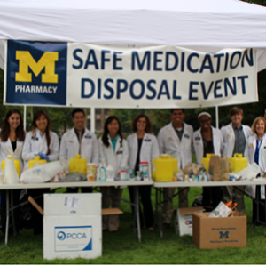 Pharmacy students participating in the safe medication disposal event