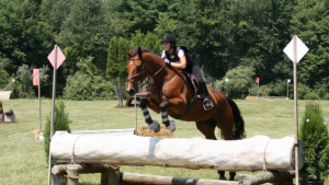 Member Sam Fox competing in eventing.