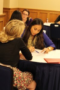 Employer helping a student with their resume during an Employer Resume Review event
