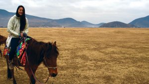 Bonderman fellow on a horse in Tibet