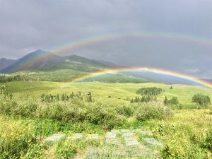 rainbows over mountain scene
