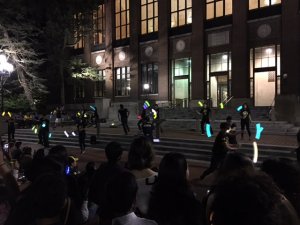 Students performing with glow sticks