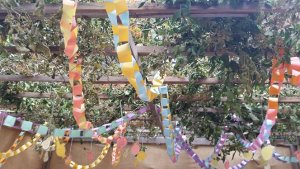 Fall Leaves and paper chains in sukkah