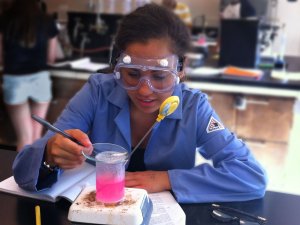 A young person doing scientific work