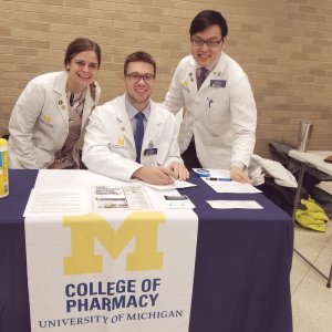 Pharmacy students collecting medication