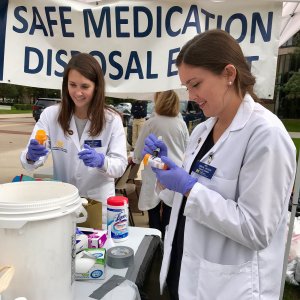 Students collecting medication