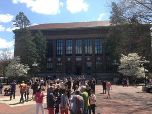 Hatcher Library with grads and parents milling on the Diag
