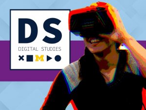 Female smiling while using VR, facing the Digital Studies logo