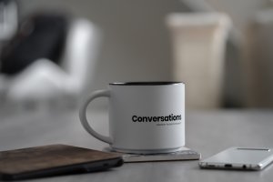conversations mug + phone taken by Cody Engel on Unsplash