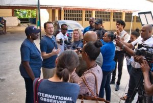 Jason Carter (speaking), chairman of The Carter Center Board of Trustees, and Aminata Touré (far left), former prime minister of Senegal, address the press in Georgetown, Guyana, on March 2, 2020, during Guyana’s elections. Carter and Touré led the 40-person delegation from The Carter Center, which monitored voting. This was the fifth election The Carter Center observed in Guyana. Credit: The Carter Center/Ron Borden