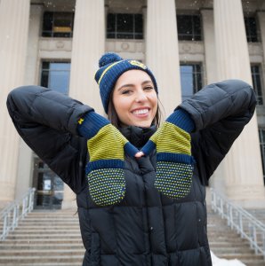 Photo of student in maize and blue mittens