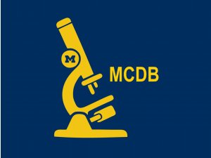 Yellow MCDB initials and cartoon of microscope on blue