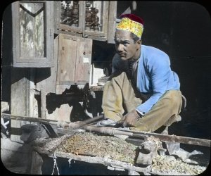 Woodturner, Damascus, Syria. By Harry A. Franck, 1904 (from a glass lantern slide). Harry Alverson Franck Papers, Special Collections Research Center, U-M Library.