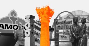 An orange column stands amidst signs and logos.
