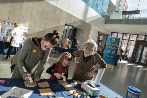 University of Michigan scientists share their cutting-edge research with museum visitors. Photo courtesy of University of Michigan Museum of Natural History/Michelle Andonian.