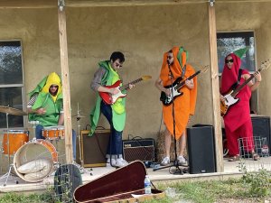 musicians in vegetable costumes playing at HarvestFest 2021