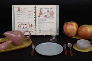 Russel Wright children’s toy plastic American Modern dish set (mid-1950s) with Betty Crocker's Cook Book for Boys and Girls (1957).