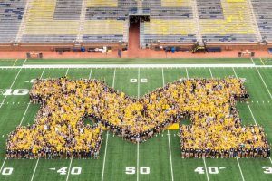 Large scale group photo in shape of block M in Michigan Stadium