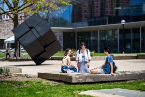 Students in front of the Cube sculpture