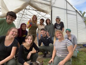 Group of Friends of the Campus Farm in Front of a Hoop House
