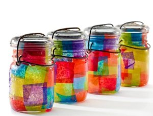 4 glass jars lined with colorful paper