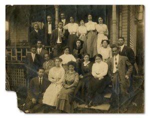 Group posed on front porch steps of Alpha Phi Alpha House, 1017 Catherine St., Ann Arbor, circa 1912. (Bentley Image Bank, Bentley Historical Library, University of Michigan)