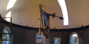 Image of a telescope and surrounding dome.