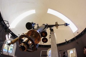 Image of a telescope and surrounding dome.