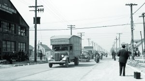 Police-escorted moving vans move Black residents’ furniture into Detroit’s Sojourner Truth Project, 1942 (Arthur S. Siegel, Library of Congress).