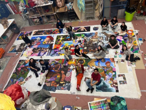 Mark Tucker's students working on their mural in the art studio.