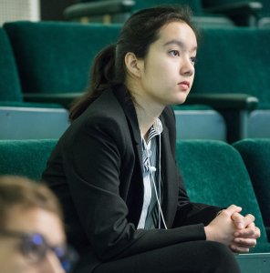 Student listening in auditorium