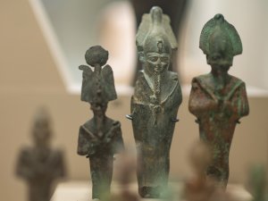 Ancient Egyptian figures in museum case