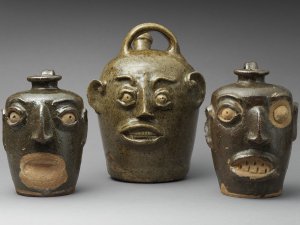 hellowhellowUnidentified potters, Edgefield District, South Carolina
Three Face Vessels, ca. mid-19th century
Alkaline-glazed stoneware with kaolin inserts
H: (from left to right) 7 in., 10 1/4 in., 7 in.The Metropolitan Museum of Art(from left to right) Rogers Fund, 1922 (22.26.4); Purchase, Nancy Dunn Revocable Trust Gift, 2017 (2017.310); Lent by April L. Hynes (L.2014.16)
