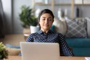 girl at computer with eyes closed